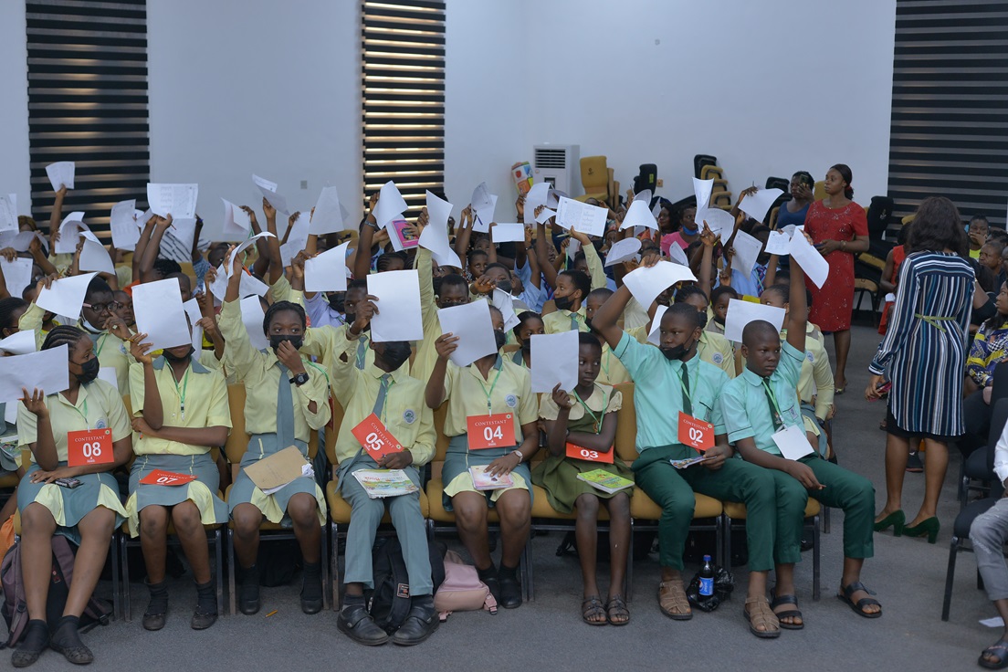 Participants holding up their papers during a group session.